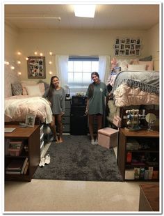 two girls standing in a dorm room with lights on the ceiling and carpeted floor