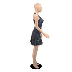 a mannequin wearing a black dress with blue and purple designs on it's torso