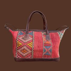 a red and brown handbag on a brown background