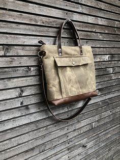 Briefcase made from heavy weight waxed filter twill in the colour ranger tan and oiled leather in the color bordeaux brown, I love the combination of these to materials. I made it big enough for laptop , and all your other necessaties. This bag is lined with a cotton canvas and there is a double inside pocket on one side. There is a large outside pocket where you can store your laptop charger and other stuff and a luggage handle attachment on the back side It closes with a metal zipper and the s Duck Canvas Bag With Leather Patch For Everyday Use, Rugged Everyday Bag With Pockets, Everyday Duck Canvas Bag With Leather Patch, Rugged Canvas Bags With Pockets, Travel Satchel With Waxed Canvas Finish, Waxed Canvas Satchel With Pockets For Outdoor, Utility Waxed Canvas Bags For Outdoor, Everyday Waxed Canvas Bag With Leather Patch, Waxed Canvas Travel Bag With Waxed Finish