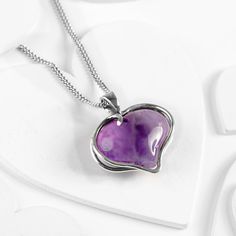 Amethyst Solid Silver Heart Necklace, Crystal Necklace, Heart Pendant, Love Necklace, Healing Chakra Stones, Birthstone Necklace Express your love for someone special with our Silver and Amethyst Necklace.  Handcrafted 925 Sterling Silver, this unique necklace has a natural Lilac Amethyst  gemstone which has been carefully shaped into a love heart which is held securely by a solid silver frame. Complete with a silver curb chain, it will brighten up any outfit.  Amethyst is a powerful gemstone an Amethyst Heart Cut Necklace For Anniversary, Heart Cut Amethyst Necklaces For Anniversary, Heart Cut Amethyst Necklace For Anniversary, Anniversary Amethyst Heart Necklace, Purple Sterling Silver Necklaces For Valentine's Day, Purple Heart Pendant Necklace For Anniversary, Elegant Heart-shaped Amethyst Necklace, Valentine's Day Amethyst Heart Necklace, Valentine's Day Amethyst Heart Pendant Jewelry