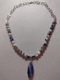 "This Lovely single strand OOAK necklace was made with Blue and White Dragons Vein Faceted Rounds and Lapis Lazuli Rondelles. In the Center is a Blue Dragon's Vein Pendant. Chain and Findings are Silver Plate. Length:  Necklace - Apx 22\", Pendant Apx 2 1/2\"" White Dragons, Hematite Necklace, Dragon Vein Agate, Length Necklace, Gemstone Beaded Necklace, Sterling Necklaces, White Dragon, Tourmaline Necklace, Tree Of Life Pendant