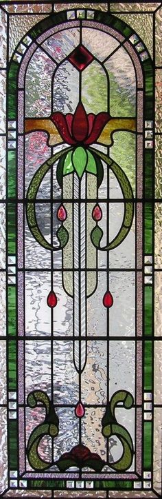 a stained glass window with flowers on it