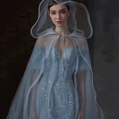 Experience luxury with this stunning "Robe Tina". Crafted with a shimmering mermaid blue fabric and sparkling accents, this sophisticated gown will make you feel special and elegantly beautiful. Its comfortable fabric will envelop you in luxurious comfort, allowing you to look and feel fabulous. Tulle Mermaid Hem Wedding Gown, Mermaid Hem Tulle Wedding Gown, Wedding Tulle Gown With Mermaid Hem, Blue Glitter Tulle Gown For Wedding, Elegant Glitter Tulle Evening Dress With Sequins, Glamorous Tulle Mermaid Wedding Dress, Elegant Light Blue Mermaid Dress For Evening, Elegant Floor-length Glitter Tulle Evening Dress, Tulle Mermaid Hem Evening Dress For Wedding