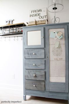 an old dresser is painted blue and has several drawers