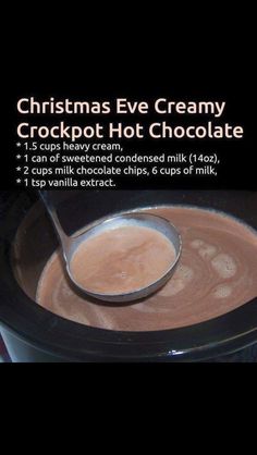 a cup of hot chocolate with a spoon in it and the recipe on the screen