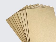 six sheets of brown paper stacked on top of each other