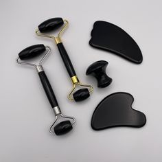 Our Black Obsidian stone facial roller and Gua Sha combo set is available in your choice of gold or silver trim and heart or feather Gua Sha. These facial tools have a refreshing soothing and smoothing effect on skin. They are super simple to use and have an immediate impact on the fluid within the tissues of the face, including blood and lymphatic systems. Face Roller and Gua Sha Benefits: Improved Circulation*: Prompt oxygen rich blood to come to the surface of the skin releasing toxins and re Gua Sha Benefits, Face Roller And Gua Sha, Black Skincare, Roller And Gua Sha, Facial Tools, Face Tools, Black Obsidian Stone, Gua Sha Facial, Black Skin Care