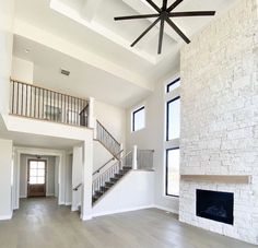 an empty living room with white walls and wood floors