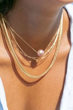 *Limited Edition* An unfailing new classic. This Edison Floating Pearl Necklace is a steadfast companion. Seemingly plucked straight from the ocean, the near round mauve pink pearl flutters along a delicate gold filled chain. This piece is striking solo or makes a bold statement layered with with a bevy of other beauties. ✦ CHOOSE YOUR ADJUSTABLE LENGTH ✦ ✦ DETAILS ✦ ✧ Name: Lokapele (lo kah PEH leh) - beautiful rose. ✧ Large 12mm-13mm Natural Mauve Edison Pearl ✧ Color will vary slightly.  ✧ 18 Hawaii Necklace, Floating Pearl Necklace, Hawaii Jewelry, Pink Pearl Necklace, Edison Pearls, Whimsical Jewelry, Beach Necklaces, Gold Pearl Necklace, Leh