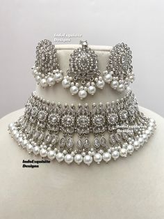 Silver color polki Necklace Set comes with Stud earrings and tikka / Indian Jewelry/ High Quality Kundan and Polki Jewelry/ Bollywood Jewelry/Wedding Jewelry   All items are shipped from Brampton, Ontario, Canada. If you need your item by a certain day, please reach out to us for express delivery option before placing the order so that we can update the shipping for you. Standard shipping/delivery timeline Below are the delivery timeline estimates once the order ia shipped ---> USA delivery timeline * 3-5 business days to major urban centers in USA. It may take 1-2 days extra to remote locations ---> Canada delivery timeline  * 2-3 business days - GTA  & Montreal  * 2-4  business days - Rest of Ontario/Quebec * 3-6 business days-  Rest of Canada    ---> Europe/Middle East timeline * 5-10 b Silver Bollywood Kundan Necklace For Ceremonial Occasions, Silver Bollywood Kundan Necklace For Eid, Silver Dual-tone Kundan Jewelry Sets, Silver Kundan Multi-stone Necklace, Luxury Silver Kundan Bollywood Necklace, Necklace Set Indian, Polki Necklace, Polki Jewellery, Bollywood Jewelry