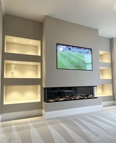 a flat screen tv mounted to the side of a wall above a fireplace in a living room