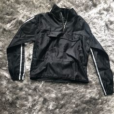 Cute Windbreaker Pullover With White Stripe Detail. Trendy Long-sleeved Black Windbreaker, Trendy Black Windbreaker, Trendy Black Long Sleeve Windbreaker, Trendy Black Track Jacket With Pockets, Trendy Black Long Sleeve Track Jacket, Trendy Black Fall Windbreaker, Cute Windbreaker, Windbreaker Jacket, White Stripe