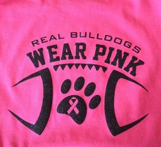 a pink t - shirt with the words real bulldogs wear pink and a dog's paw on it