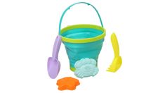 a toy bucket and shovel with sand in it