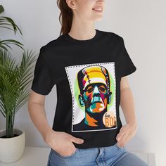 ⭐⭐Item Details ⭐⭐ *Men Graphic T-Shirt, Gift for Mom, Pop Art Shirt, Woman Clothing, Gift for her, Unisex Shirt, Dad Tees, Gift for daughter, Girlfriend gift *This UNISEX t-shirt comes with a lightweight fabric (4.2 oz/yd² (142 g/m that is easy to layer thanks to its breathability and the perfect choice for both active and leisure wear.  PLEASE BE ADVISED: THE SIZE IT'S TRUE TO SIZE. *Fabric blends: Ash - 99% Airlume combed and ring-spun cotton, 1% polyester Heather colors and Solid Black Blend - 52% cotton, 48% polyester, Athletic Heather and Black Heather - 90% cotton, 10% polyester. ⭐⭐ Caring and Washing instructions ⭐⭐ Machine wash: cold (max 30C or 90F); Non-chlorine: bleach as needed; Tumble dry: low heat; Iron, steam or dry: medium heat; Do not dryclean. ⭐⭐ How to Order ⭐⭐ 1- Please Casual Tops With Custom Artwork For Gift, Casual Tops With Custom Artwork As Gift, Cotton Graphic Design Top As Gift, Cotton Tops With Graphic Design, Custom Artwork Short Sleeve T-shirt For Gift, Short Sleeve T-shirt With Custom Artwork As Gift, Graphic Tee With Graphic Design As Gift, Graphic Tee Tops As Gift, Graphic Tee With Graphic Design For Gift