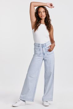 image of a female model wearing a AUDREY SUPER HIGH RISE WIDE LEG JEANS ARTHLOW DEAR JOHN DENIM Chic Light Wash Flare Jeans For Everyday, Trendy Mid-rise Wide Leg Pants For Everyday, Mid-rise Wide Leg Pants For Summer, Summer Wide Leg Flare Jeans For Everyday, High Rise Wide Leg Pants For Summer, High Rise Wide Leg Pants For Summer Everyday Wear, Summer High Rise Wide Leg Pants For Everyday, Chic Light Wash Mid-rise Wide Leg Pants, Chic Light Wash Wide-leg Jeans