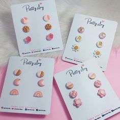 three pairs of pastey pink and gold earrings on a white card with the words pastey pink