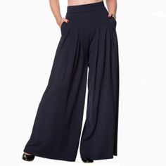 Size: Xs Color: Night Blue Material: 90% Cotton, 10% Elastane Description: Banned Retro Beautiful Pair Of Night Blue Wide Leg Elastic Waistband, With Side Pockets And Hidden Back Zipper. Vintage Meets Gypsy! These 70s Indiana Trousers In Night Blue Are Playful, Stylish And Comfy At The Same Time! The Feminine Elastic High Waist Forms A Beautiful Contrast With The Wide Leg And Is Very Flattering, Also With Fuller Hips/Bottom. The Gorgeous Pleats Finish Off The Easy Going, Laid Back Look. Made Fro Retro Wide Leg Bottoms For Night Out, Retro Wide Leg Solid Bottoms, Retro Bottoms For Spring Night Out, Retro Spring Bottoms For Night Out, Retro Bottoms For Night Out In Spring, Retro High Waist Solid Bottoms, Blue High Waist Wide Leg Pants For Night Out, Retro Stretch Bottoms For Night Out, Black Work Trousers