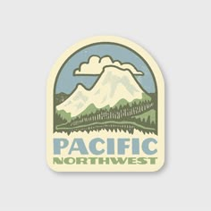 a sticker with the words pacific northwest in front of a mountain and forest scene