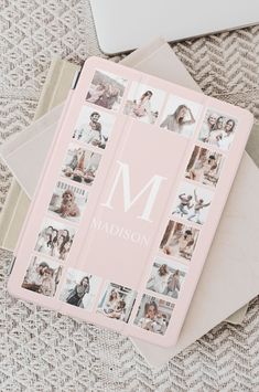 a personalized notebook with photos and the letter m is shown on top of an envelope