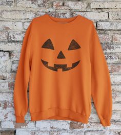 Wear this fun Halloween Pumpkin Face Sweatshirt to a party or when you trick-or-treat! Halloween Pumpkin Face Sweatshirt, Pumpkin Jack-O-Lantern Print Scary Sweatshirt, Happy Halloween Sweater Gift .: Loose fit .: 50% Cotton; 50% Polyester (fibre content may vary for different colors) .: Medium fabric (8.0 oz/yd² (271.25 g/m .: Sewn in label .: Runs true to size FINER DETAILS * Printed on super soft premium material * Designed in the U.S.A. * Made to last PROPER SIZING Please see photos to see the specific sizing chart for this clothing item. Our shirts are unisex size, meaning they are not women's fitted shirts. If would like a more fitted look, we suggest that you size down. To get your size, lay your favorite shirt at home flat, measure armpit to armpit, and then compare to the size cha Fitted Shirts, Pumpkin Sweatshirts, Pumpkin Face, Pumpkin Jack, Halloween Sweater, Pumpkin Faces, Sweater Gift, Limassol, Look Plus