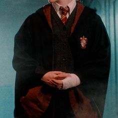 a young boy dressed in harry potter costume