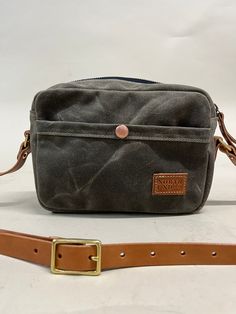 Our smallest crossbody. Built with structure, durability, and a lifetime of use. Designed with one exterior pocket to store your phone on the go and one interior pocket to organize all necessities. Black On Black, Waxed Canvas, Small Crossbody, Vegetable Tanned Leather, Brass Hardware, Natural Leather, New Bag, Tan Leather, Solid Brass