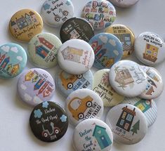 a bunch of buttons that are on a white surface with the words welcome to our home