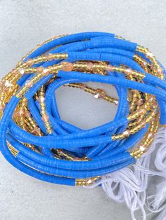 "FREE SHIPPING!! Please Note: Please scroll to see options. **These waist beads ship from Ghana, West Africa. They are traditional and authentic yet fancy and fashionable.* **I will send you nice selection of Waist beads unless you want to make your own choices, then you can email me to send you individual pictures of the waist beads. #Waist beads sizes vary from 35\"-45\" #They are all made with cotton threads #Bead sizes vary from 6/0, 8/0 12/0, 14/0" Bohemian Blue Handmade Waist Beads, Handmade Blue Bohemian Waist Beads, Handmade Bohemian Blue Waist Beads, Blue Beaded Bracelets With Gold Beads For Festival, Traditional Blue Beaded Necklace With Gold Beads, Bohemian Blue Waist Beads With Spacer Beads, Beads Waist, Acrylic Toes, Acrylic Toe Nails