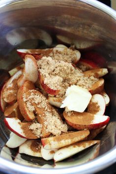 apples and cinnamon in a pot with sugar on top