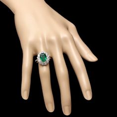 4.10 Carats Natural Emerald and Diamond 18K Solid White Gold Ring Suggested Replacement Value: $7,000.00 Total Natural Green Emerald Weight is: Approx. 3.00 Carats (transparent) Emerald Measures: 9 x 7mm Natural Round Diamonds Weight: Approx. 1.10 Carats (color G-H / Clarity SI1-SI2) Ring total weight: Approx. 6.4 grams Disclaimer: all weights, measurements and colors are approximate and may vary slightly from the listed dimensions or as seen in the image. All pictures are magnified to show the Luxury Green Cluster Ring For Formal Occasions, Luxury Green Cluster Ring For Formal Events, Luxury Green Halo Ring For Formal Occasions, Gia Certified Emerald Ring For Formal Occasions, Emerald Cut Aquamarine Ring, Emerald Gem, Emerald Cut Rings, Etsy Gold Ring, Blue Sapphire Diamond