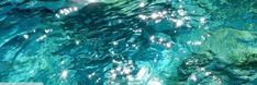 the water is so clear that it appears to be crystal blue and has many bubbles