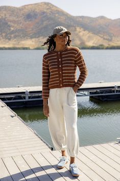 Keep this cardi in your sights this Fall. Featuring a chunky knit, functional buttons, and two natural colors, the Girl Like You Stripe Sweater Cardigan will be your new fav! ivory has navy stripes Ivory // paired with the free people good luck mid rise barrel jeans in light blue + the la baseball cap in darkseagreen chocolate // paired with the come together tapered pants in white, la baseball cap in tan, + steve madden madrid sneakers in steelblue Cozy Striped Knit Outerwear, La Baseball Cap, Readable Fonts, Clogs Heels, Barrel Jeans, Invert Colors, Mom Accessories, Nursing Friendly, Tapered Pants