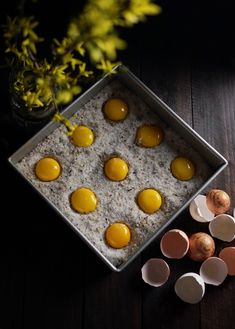 some eggs are sitting in a pan on a table