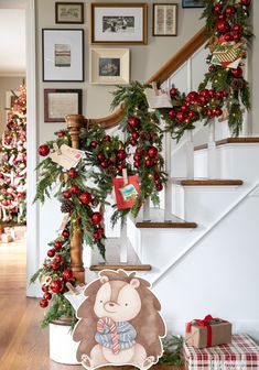 christmas decorations on the banisters and stairs in a house with teddy bear decoration