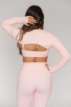 Complete your studio, or every day, look with our Long Sleeve Shrug. This cute cover-up features long sleeves and an open front design. Pairs perfectly with your favorite Soft Pink bra top: the Scoop Bra or the One Shoulder Bra. Stretch Long Sleeve Crop Top For Loungewear, Solid Color Long Sleeve Crop Top For Loungewear, Solid Long Sleeve Crop Top For Loungewear, Pink Stretch Long Sleeve Crop Top, Long Sleeve Stretch Crop Top, Pink Long Sleeve Stretch Crop Top, High Stretch Long Sleeve Crop Top For Loungewear, Pink Long Sleeve Tops With Thumbholes, Trendy Solid Color Open Front Tops