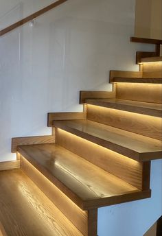 a set of wooden stairs with lights on them