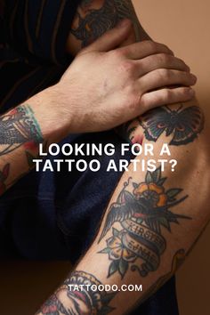 a tattooed arm with the words looking for a tattoo artist?