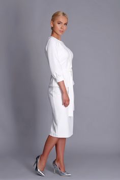 A minimalist two piece set featuring pencil skirt and 3/4 baloon sleeve tunic. tunic: - scoop neck - peplum silhouette - 3/4 baloon sleeve - front pleat - matching fabric belt - concealed back zipper closure - fully lined skirt: - midi length - pencil silhouette - concealed back zipper closure - fully lined Color: milky white The outer fabric : 40% viscose, 55% polyester, 5% elastane. The lining : 57% Viskose, 35% polyester, 8% elastane. Care: cold hand wash with similar colour. Please choose fr Elegant 3/4 Sleeve Midi Wedding Dress, Elegant White Midi Dress For Office, White Midi Dress For Office, Elegant White Dress With 3/4 Sleeves, White 3/4 Sleeve Dress For Work, Fitted White Midi Dress For Office, White Midi Dress For Office Wear, Elegant 3/4 Length Day Dresses, Elegant White Office Dress