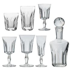 an assortment of clear glassware including a decanter