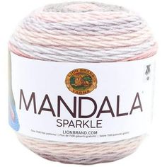 a ball of yarn with the words mandala in white and pink on it