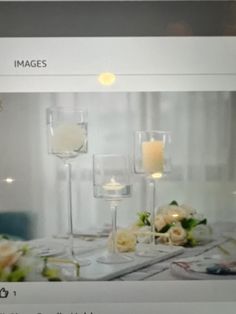 an image of wine glasses with flowers and candles on the table in front of them