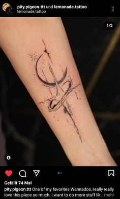 a tattoo on the arm of a person with a cross and arrow in black ink