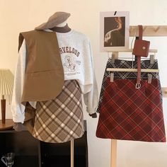 Mini a-line tweed plaid skirt with a concealed back zipper and lined with safety shorts. S: 25" waist, 15.5" lengthM: 26.5" waist, 15.5" lengthL: 28" waist, 16" lengthXL: 29.5" waist, 16" length Fall Plaid Lined Skort, Winter School Plaid Mini Skirt, Preppy Plaid Mini Skirt For Fall, Plaid Mini Skirt For School In Winter, Fall School Mini Skort, Winter Mini Length Plaid Skirt, Fall Plaid Lined Mini Skirt, Winter Workwear Plaid Mini Skirt, Plaid Mini Skirt For Winter Workwear