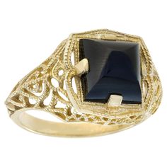 The band features an exquisite milgrain work of swirling filigree pattern, reminiscent of lace or spiderwebs. The intricate design, adorned with tiny loops and curves, gracefully dances across the surface, evoking a sense of inspired vintage charm and femininity for the ring. Enhancing this allure is a 5.80 square shaped onyx gemstone elegantly held in a prong setting, creating a sophisticated and charming look. CHARACTERISTICS Origin: Thailand Metal: Solid 9K Yellow Gold Ring Size: US7 Total Ge Onyx Color, Akoya Pearl Earrings, Onyx Colour, Filigree Pattern, Jewelry Auction, Filigree Ring, Yellow Gold Rings, Solitaire Ring, Vintage Stil