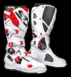 a pair of white and red motorcycle boots