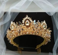 "This gold crown has a luxurious gold color and excellent shine.  Wedding tiara is made of the finest materials: crystal beads and rhinestones, metal elements and gold wire. Gold tiara height in center: Approx. 2.75\" (7 cm). Length of gold earrings: Approx. 3.5\" (9 cm). Crowns from the Exclusive Wedding Shop are always: * unique author's design * stunning detail * 100% handiwork * light weight for comfortable wearing * quality materials * large assortment for any occasion * All orders from the Exclusive Wedding Shop you will receive in a FREE beautiful gift box. * Standard shipping: - USA: 12-15 business days - Europe: 3-5 weeks - Canada: 6-10 weeks - Australia: 6-10 weeks - Rest of World: 4-10 weeks * Express shipping UPS: 7-9 business days (around the world). If you have any questions Gold Tiara Wedding, Gold Crown Wedding, Gold Bridal Tiara, Gold Leaf Crown, Gold Bridal Crowns, Wire Crown, Tiara Gold, Crown Gold, Gold Headpiece