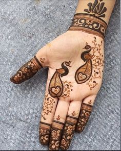 henna tattoo on the palm of someone's hand