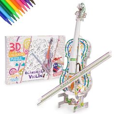 the 3d violin is next to colored pencils and an artist's kit on a white background